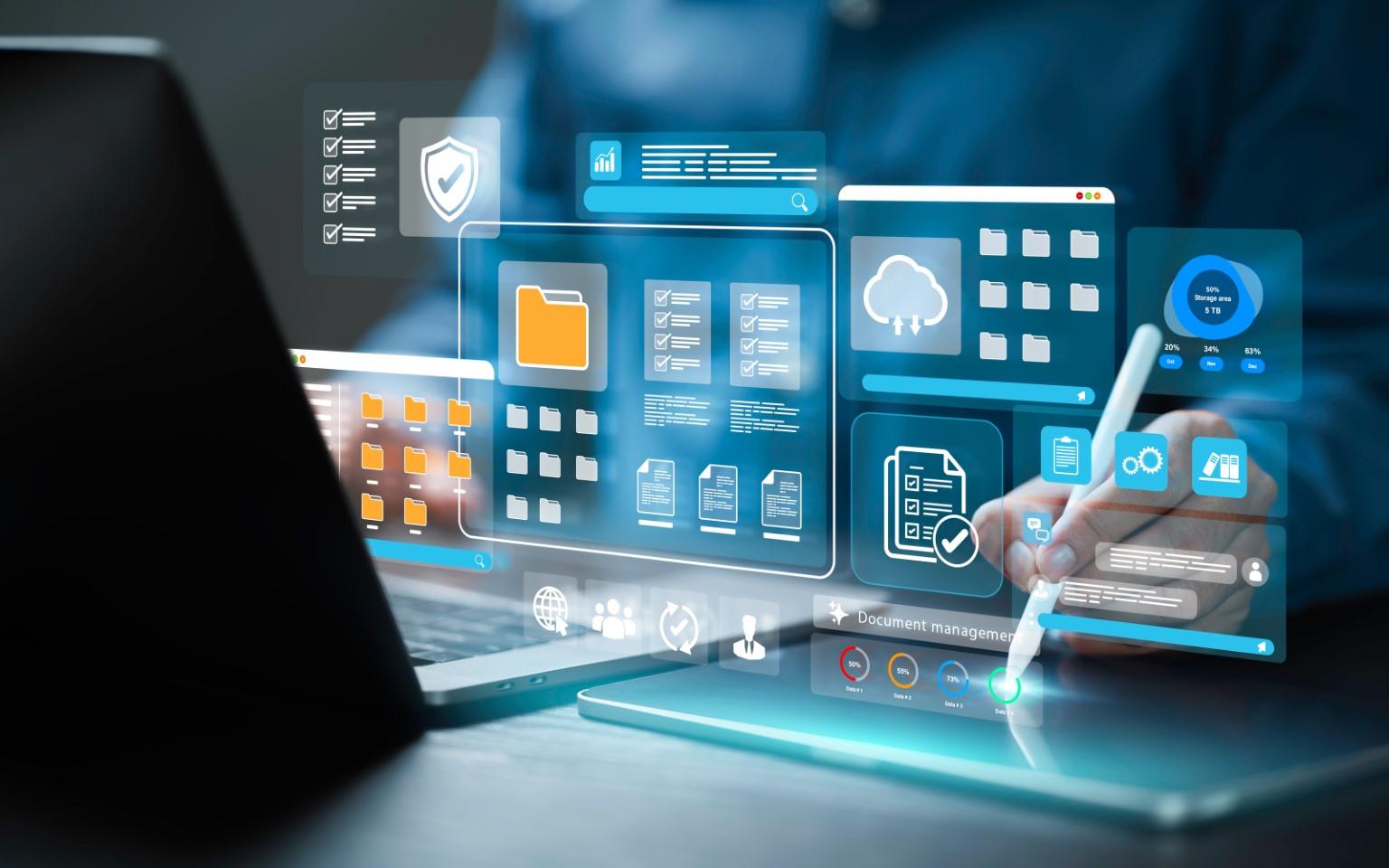 This is a visualization of how to access Usenet. A person is holding a stylus over a tablet in front of a laptop. There are various holographic windows hovering over his hand and the laptop keyboard.